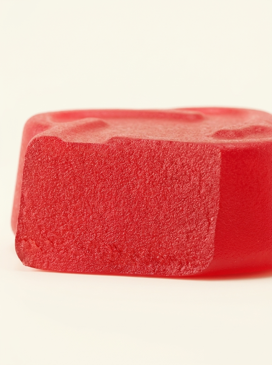 Macro close-up of an Arq8 creatine gummy showing its texture